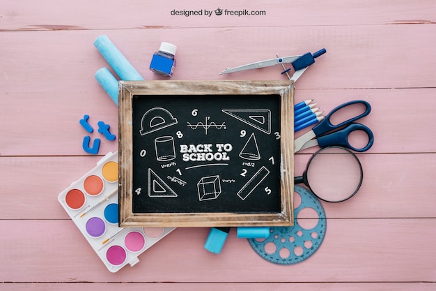 Back to school composition with slate on wooden surface PSD Template