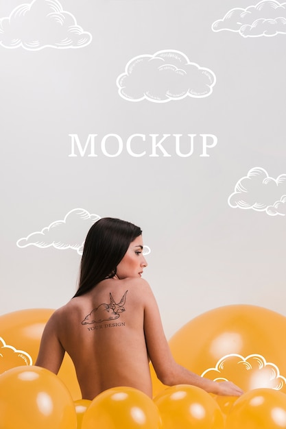 Back view model with tattoo on her back mock-up Free Psd