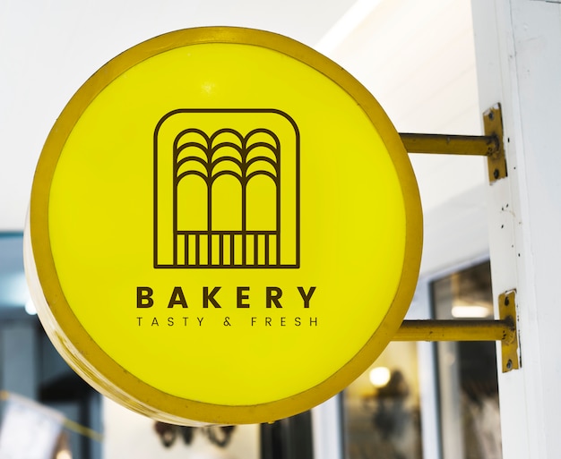 Download Free PSD | Bakery store's yellow shop sign mockup