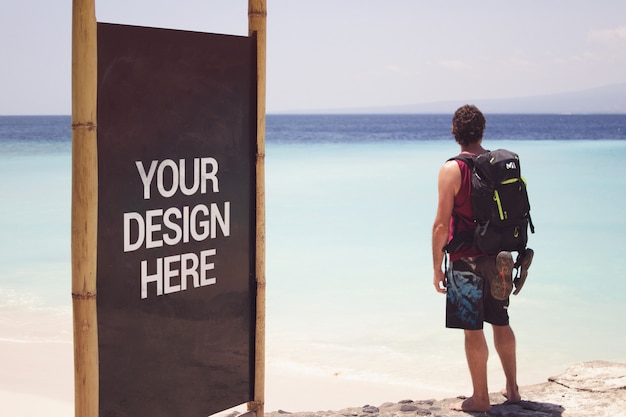 Download Beach black slate mockup with a traveler | Premium PSD File