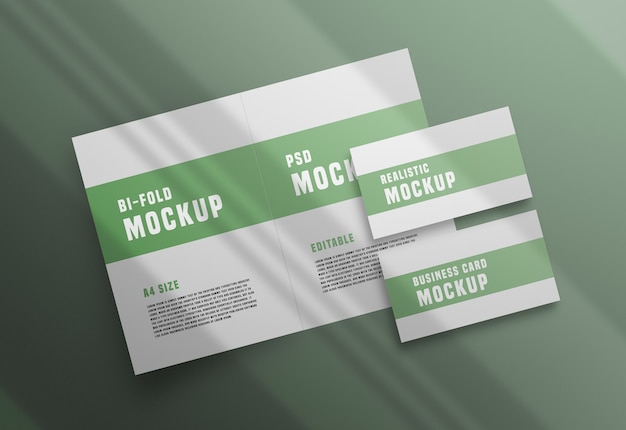 Bifold brochure with a business card psd mockup Free Psd