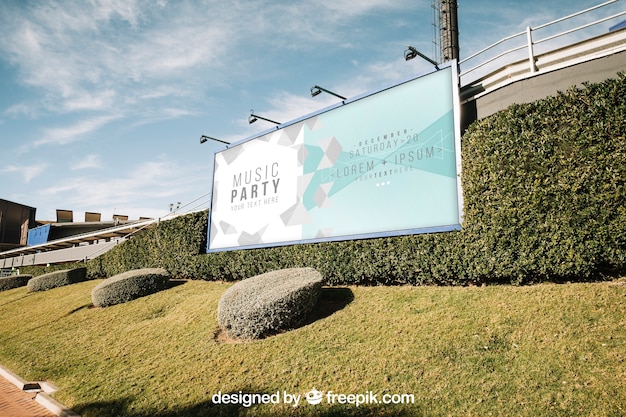 Billboard mockup in green urban environment Free Psd