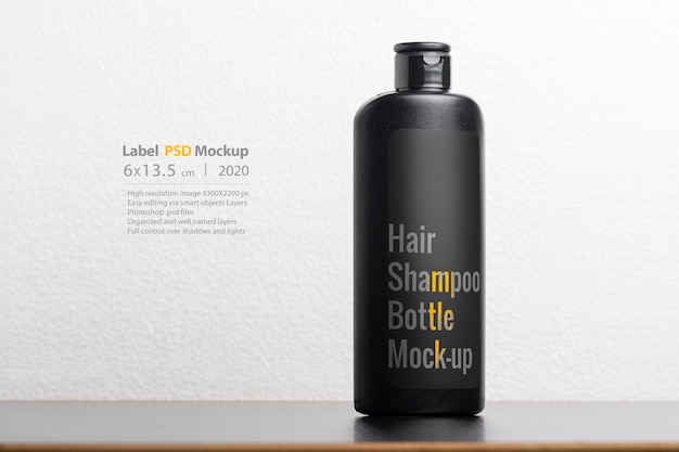 Premium PSD | Black hair shampoo bottles mockup
