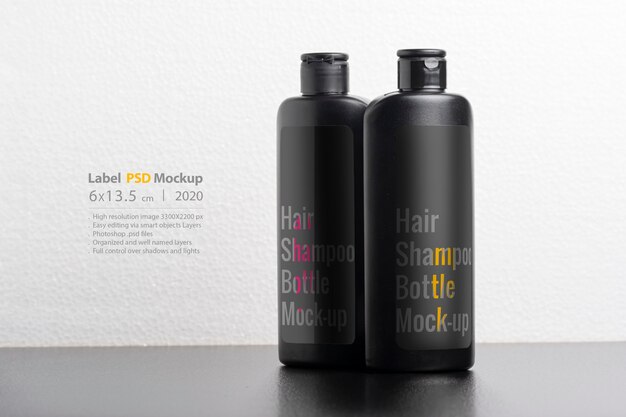 Download Premium PSD | Black hair shampoo bottles mockup