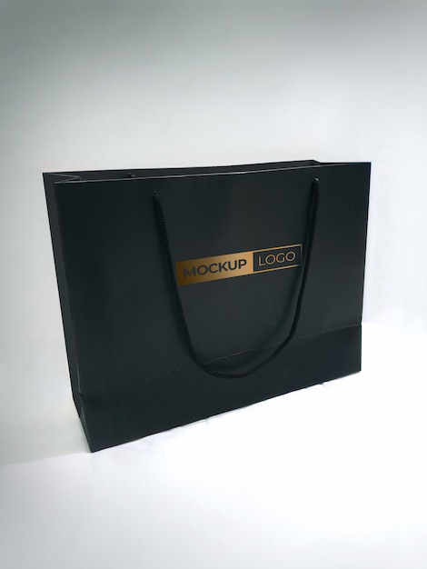 Download Black shopping paper bag mockup with golden logo | Premium ...