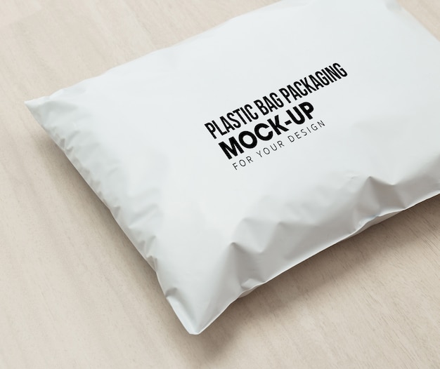 Download Premium PSD | Blank white plastic bag package mockup template on wooden background.