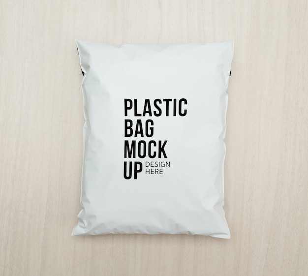 Download Premium PSD | Blank white plastic bag package mockup template on wooden.
