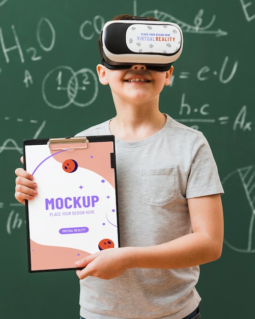 Free PSD | Boy wearing virtual reality headset with clipboard mock-up