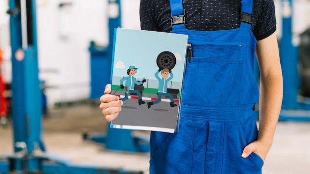 Download Free PSD | Car mechanic holding cover mockup