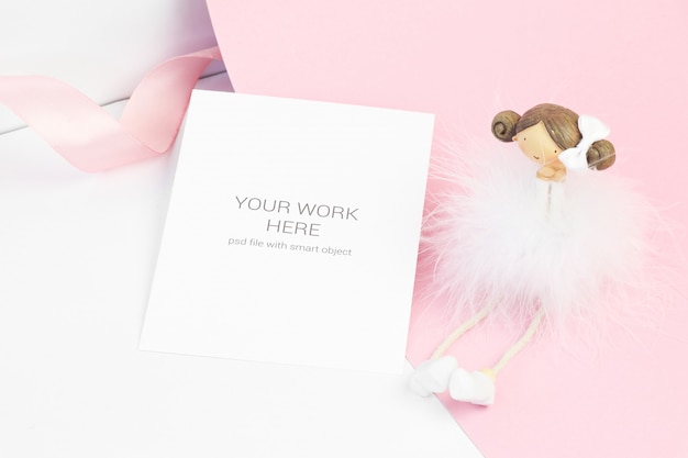 Download Premium PSD | Card mockup with figurine and ribbon