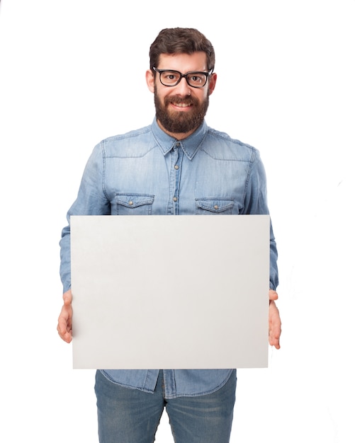Cheerful guy showing a blank placard Free Psd