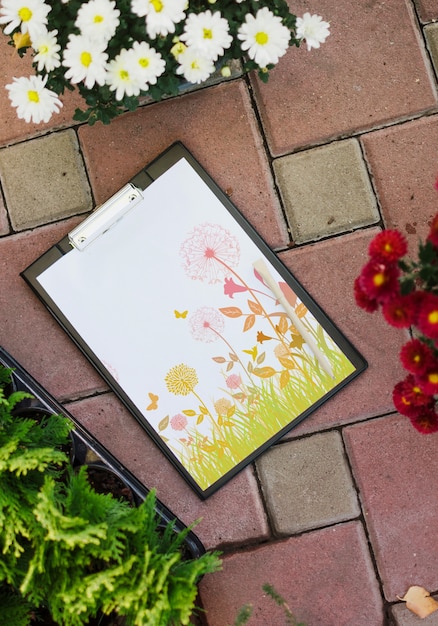Download Clipboard mockup with flowers | Free PSD File