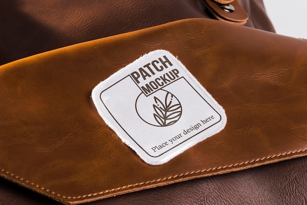 Download Premium PSD | Clothing patch mock-up on leather bag