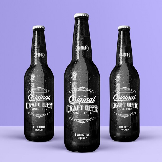 Download Cold crafted studio black glass beer bottles mockup PSD ...