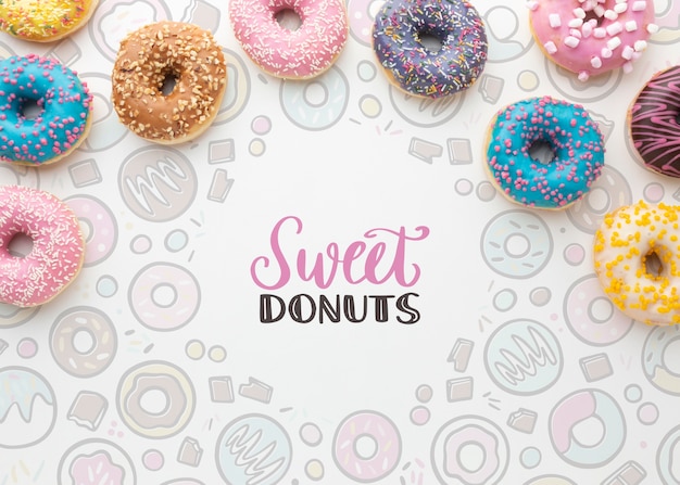 Download Free PSD | Colorful donuts arrangement with mock-up