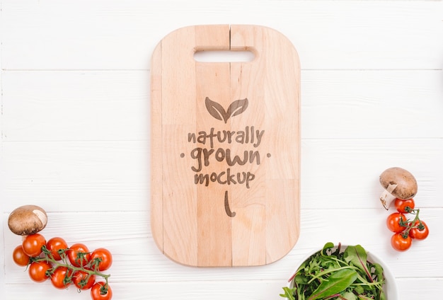 Download Cutting board and tomatoes vegan food mock-up | Free PSD File