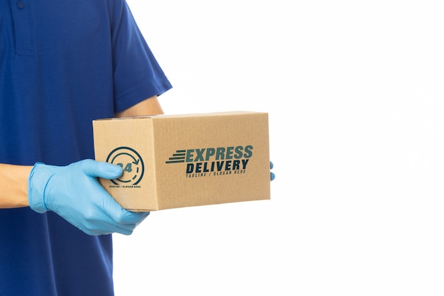 Download Premium PSD | Delivery man hand holding cardboard boxes mockup