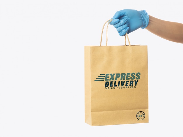 Download Delivery man hand holding craft paper shopping bag mockup template, packaging mockup, delivery ...