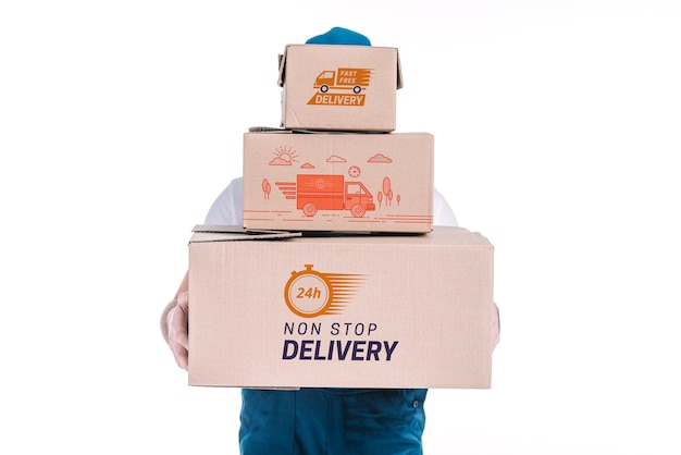 Delivery mockup with man holding boxes Free Psd