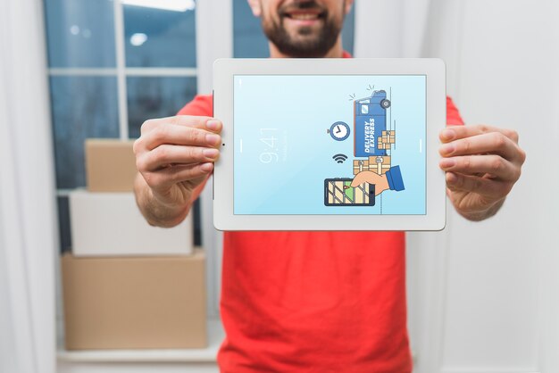 Download Delivery mockup with man holding tablet PSD file | Free ...
