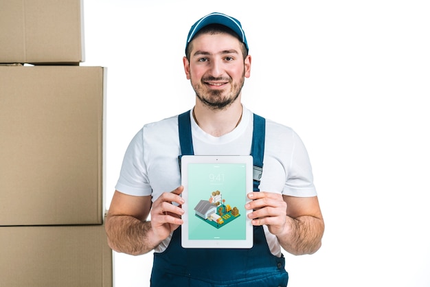 Download Delivery mockup with man showing tablet | Free PSD File