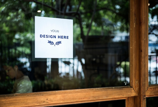 Download Design space on a glass window sign | Premium PSD File