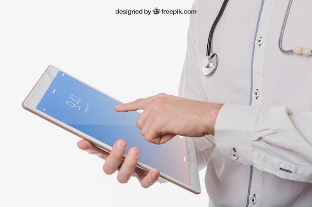 Doctor's hands with tablet's mock up PSD file | Free Download