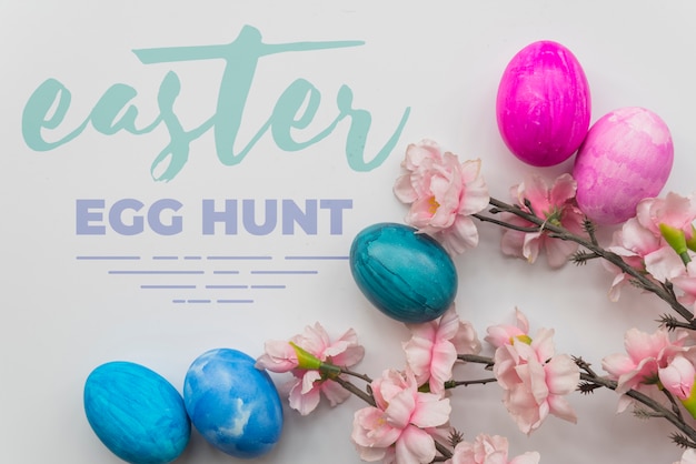 Download Easter mockup with eggs and branches | Free PSD File