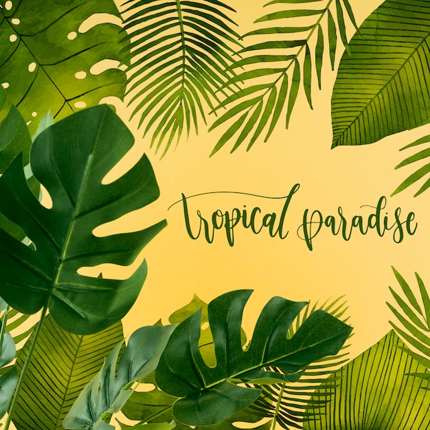 Download Flat lay copyspace mockup with tropical leaves | Free PSD File