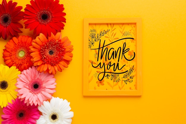 Download Free Psd Flat Lay Of Frame And Flowers On Yellow Background PSD Mockup Templates