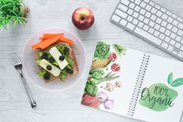 Download Flat lay of healthy food with notepad mockup | Free PSD File