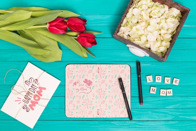 Flat lay mothers day composition with open book mockup Free Psd