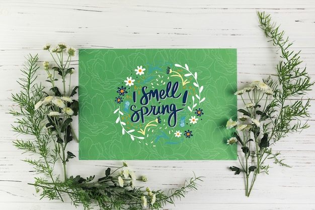 Flat lay paper card mockup with spring concept Free Psd