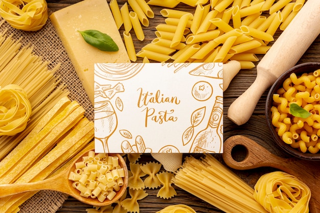 Download Flat lay uncooked pasta assortment with white rectangle ...