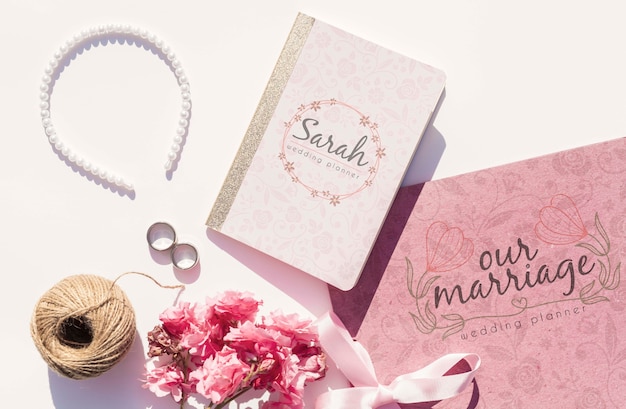 Free PSD | Flat lay wedding ideas with wedding planner and pearls