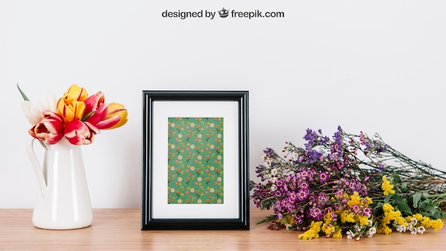 Download Free Psd Floral Mockup Of Frame On Desk