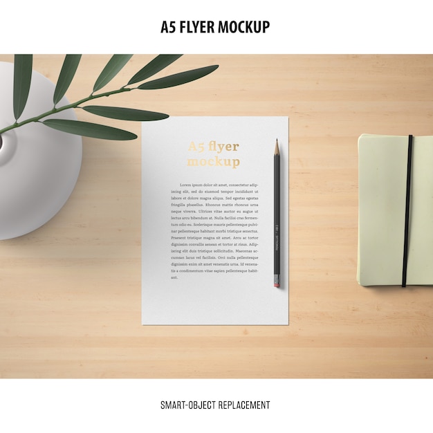 Download Flyer mockup in a desktop | Free PSD File