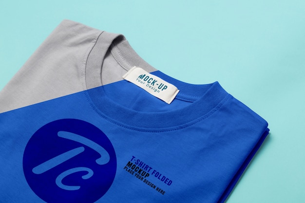 Download Free Folded T Shirts Mockup Template For Your Design On Blue Premium Use our free logo maker to create a logo and build your brand. Put your logo on business cards, promotional products, or your website for brand visibility.