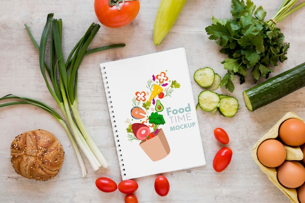 Download Fresh vegetables and notebook mock-up | Free PSD File
