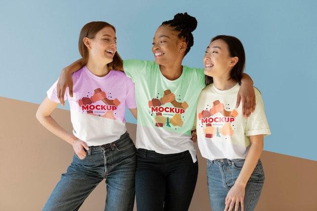 Friends representing the inclusion concept with mock-up t-shirts Free Psd