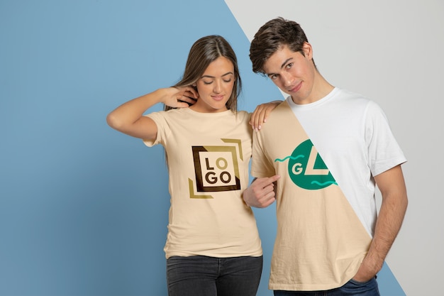 Download Premium PSD | Front view of couple posing in t-shirts