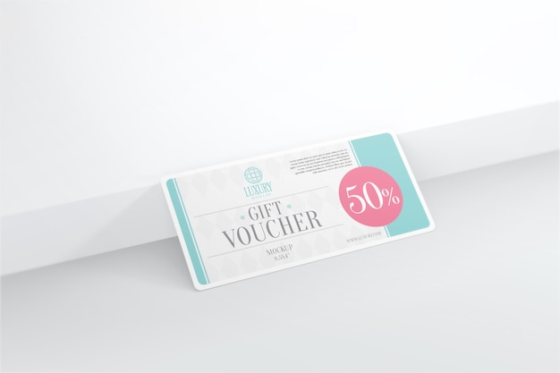 Download Premium PSD | Gift voucher mockup at wall