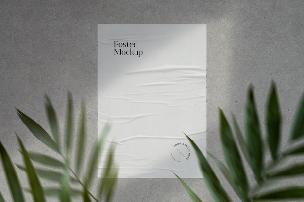 Download Premium PSD | Glued poster mockup with shadows and greenery