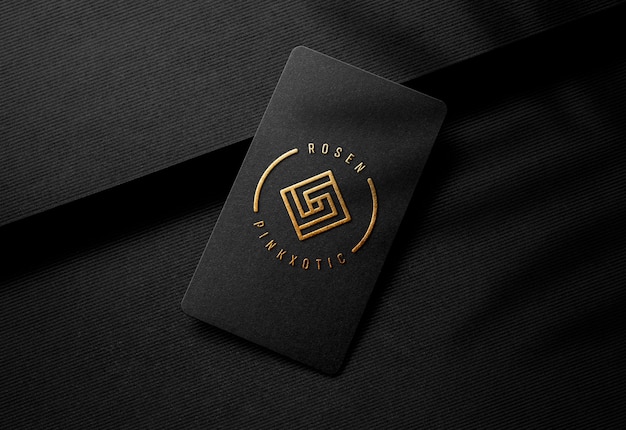 Gold embossed logo mockup on luxury black business card | Premium PSD File