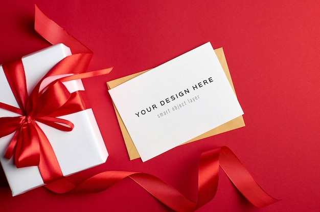 Download Premium PSD | Greeting card mockup with gift box on red ...