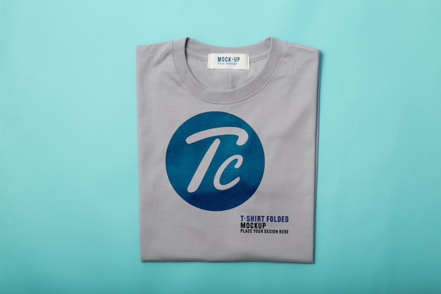 Download Grey folded t-shirts mockup template for your design on blue background | Premium PSD File