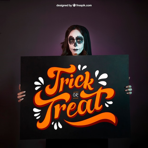 Halloween mockup with girl holding big board | Free PSD File