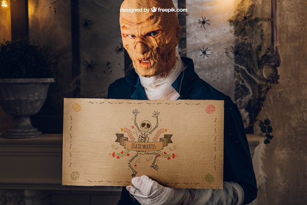 Download Free Psd Halloween Mockup With Monster Holding Cardboard