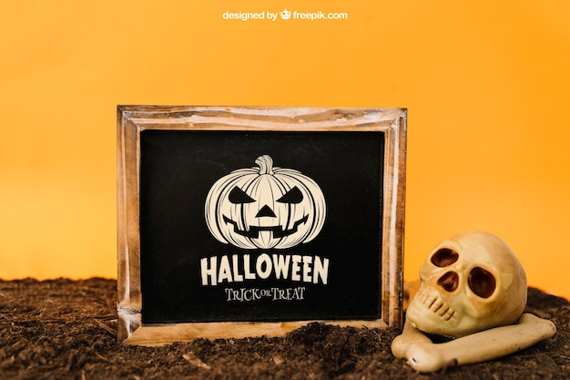 Download Halloween mockup with slate and skull | Free PSD File