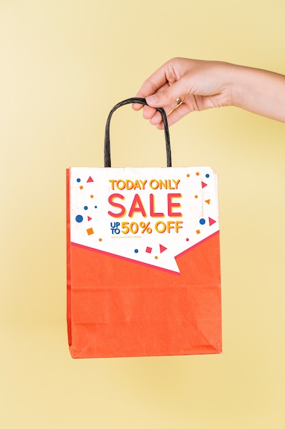 Download Hand holding shopping bag mockup | Free PSD File